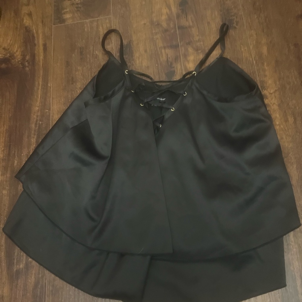 Black loose fitting silk top.